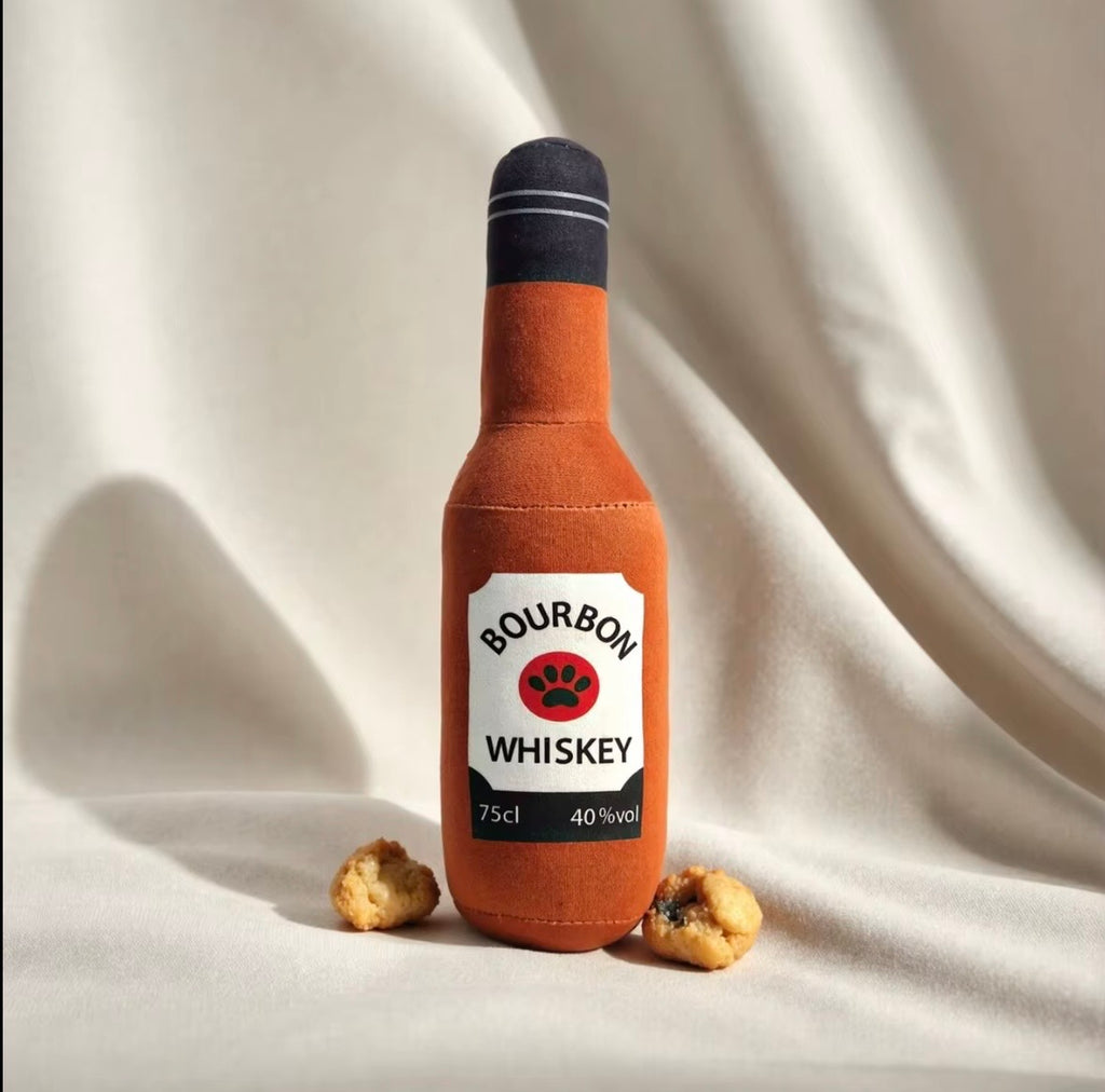 plush, squeaky bottle-shaped toys designed for dogs and cats, featuring various liquor and wine brand parodies.