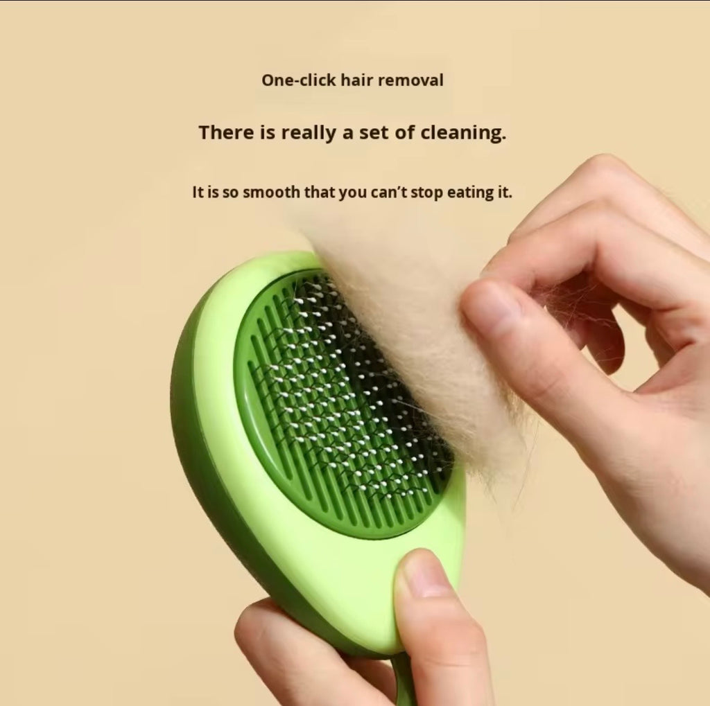 avocado-shaped 2-in-1 pet grooming brush designed for de-shedding and massaging dogs and cats.