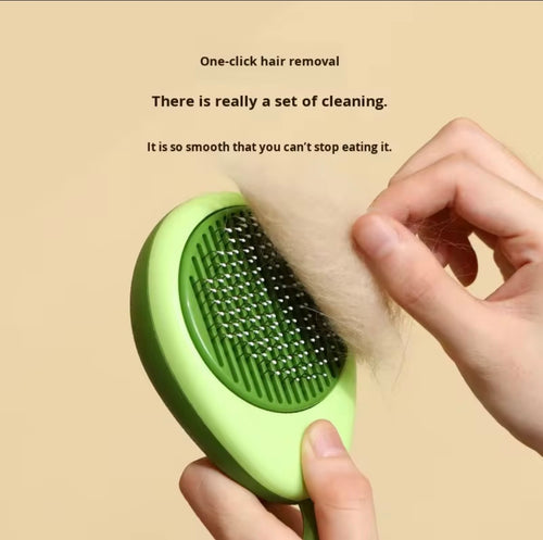 avocado-shaped 2-in-1 pet grooming brush designed for de-shedding and massaging dogs and cats.