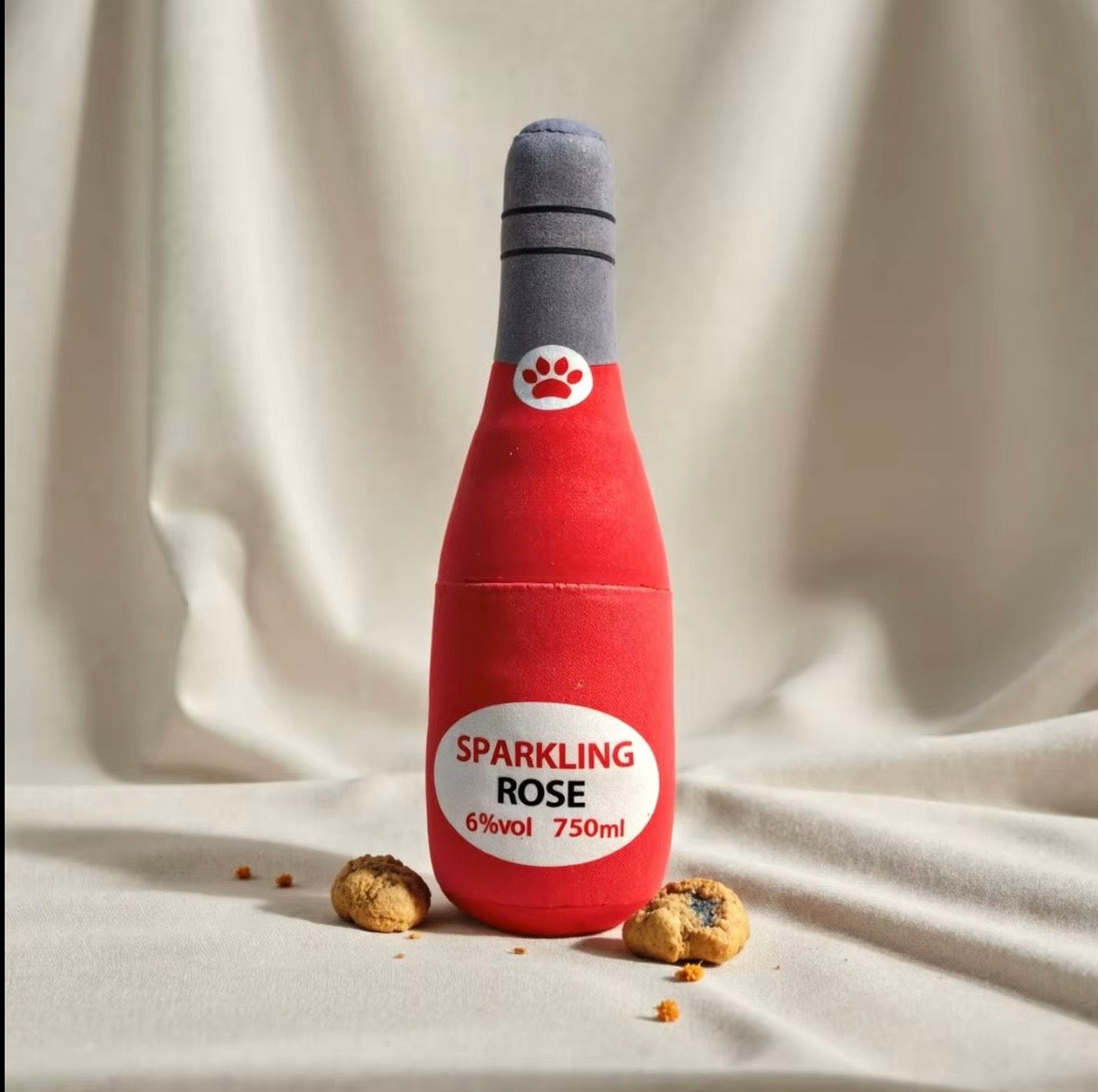 plush, squeaky bottle-shaped toys designed for dogs and cats, featuring various liquor and wine brand parodies.