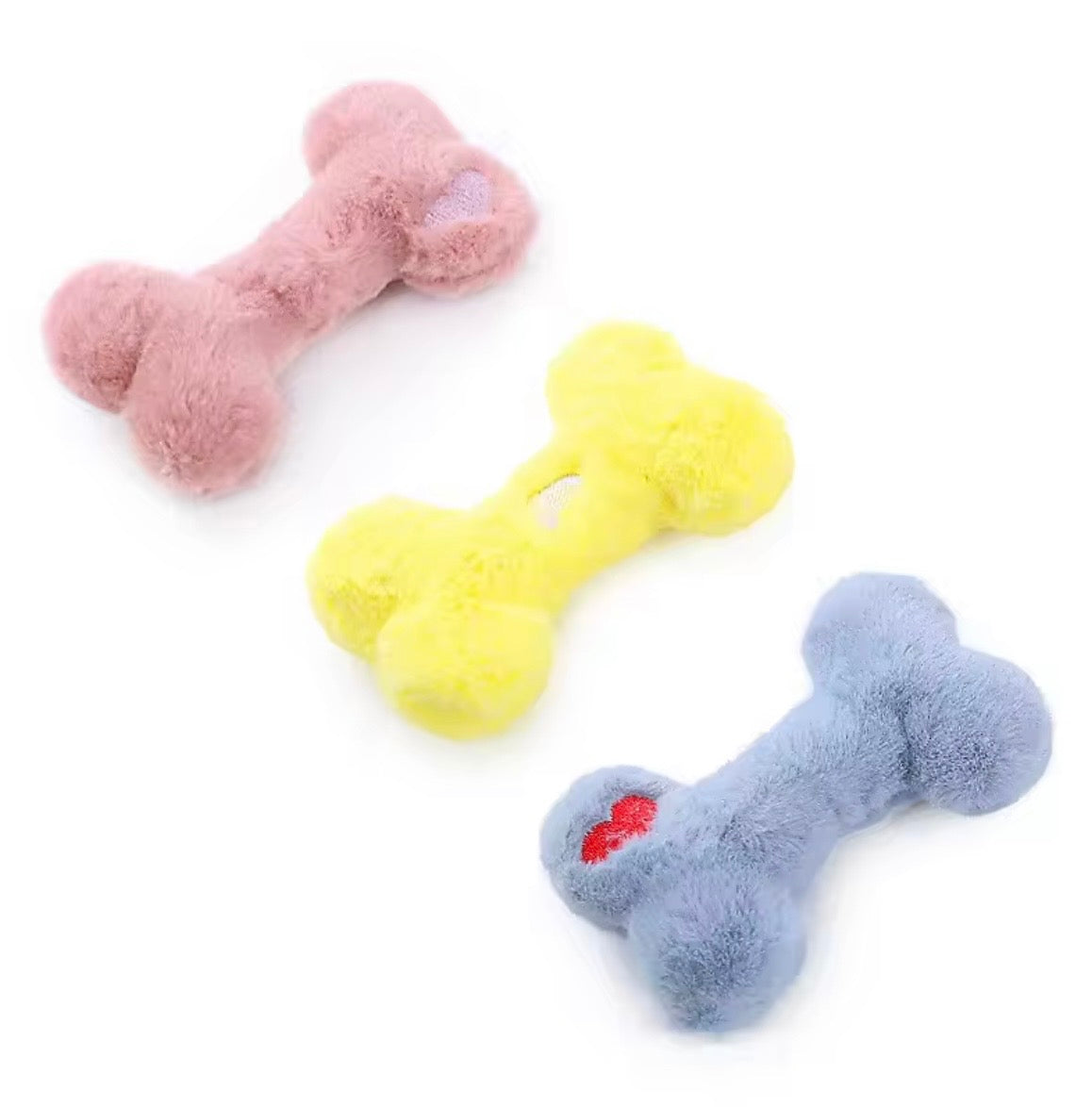 Funny Bone Squeaky Plush Dog Toys available in yellow, blue, and pink