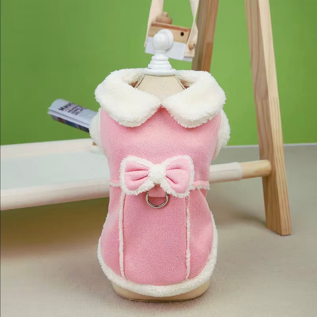 Jecikelon brand beige suede winter coat for small dogs featuring a white fleece lining, turtleneck collar, and decorative bow tie.