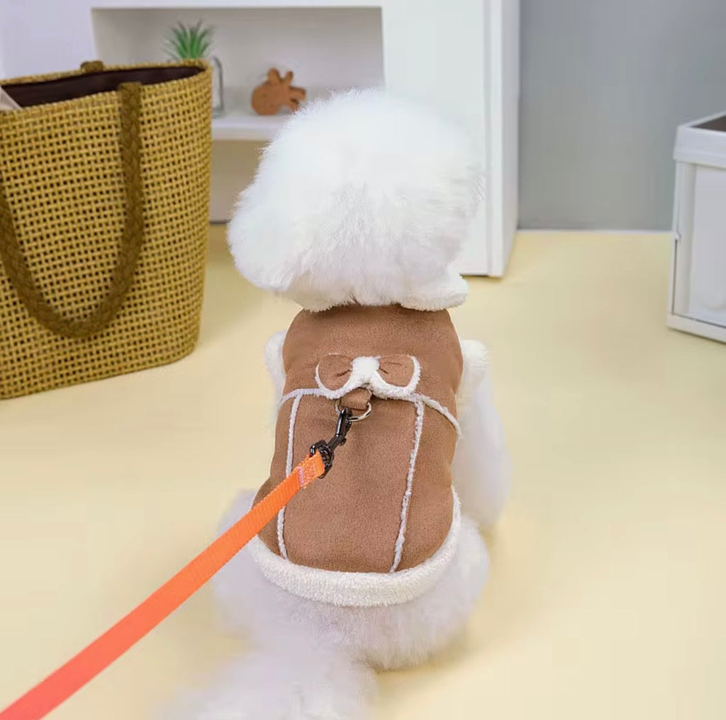 Jecikelon brand beige suede winter coat for small dogs featuring a white fleece lining, turtleneck collar, and decorative bow tie.