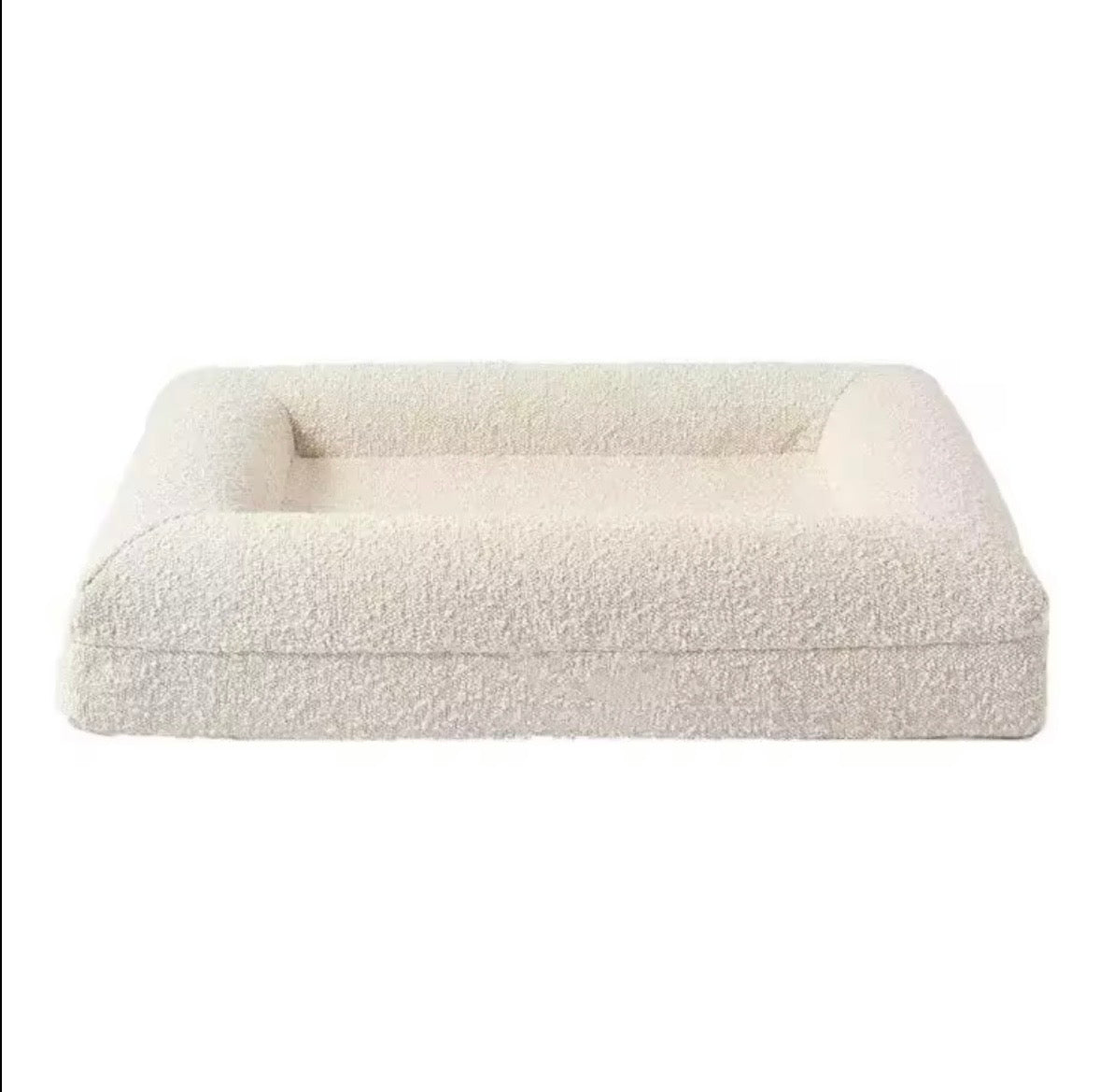 Dazy Dog orthopaedic dog bed featuring a machine-washable ivory bouclé cover.