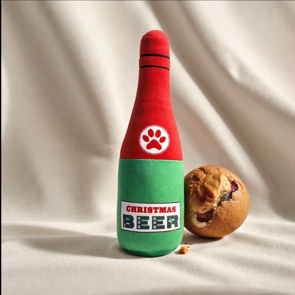 plush, squeaky bottle-shaped toys designed for dogs and cats, featuring various liquor and wine brand parodies.