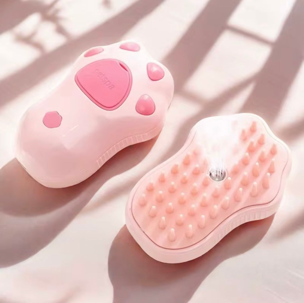 3-in-1 electric steamy pet grooming brush, featuring a rechargeable design with a khaki handle and orange silicone bristles.