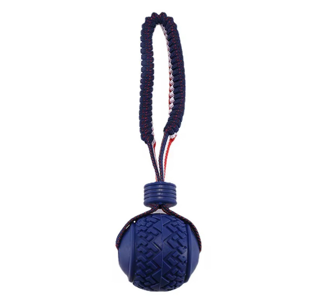 blue interactive dog toy featuring a textured ball on a red, white, and blue rope