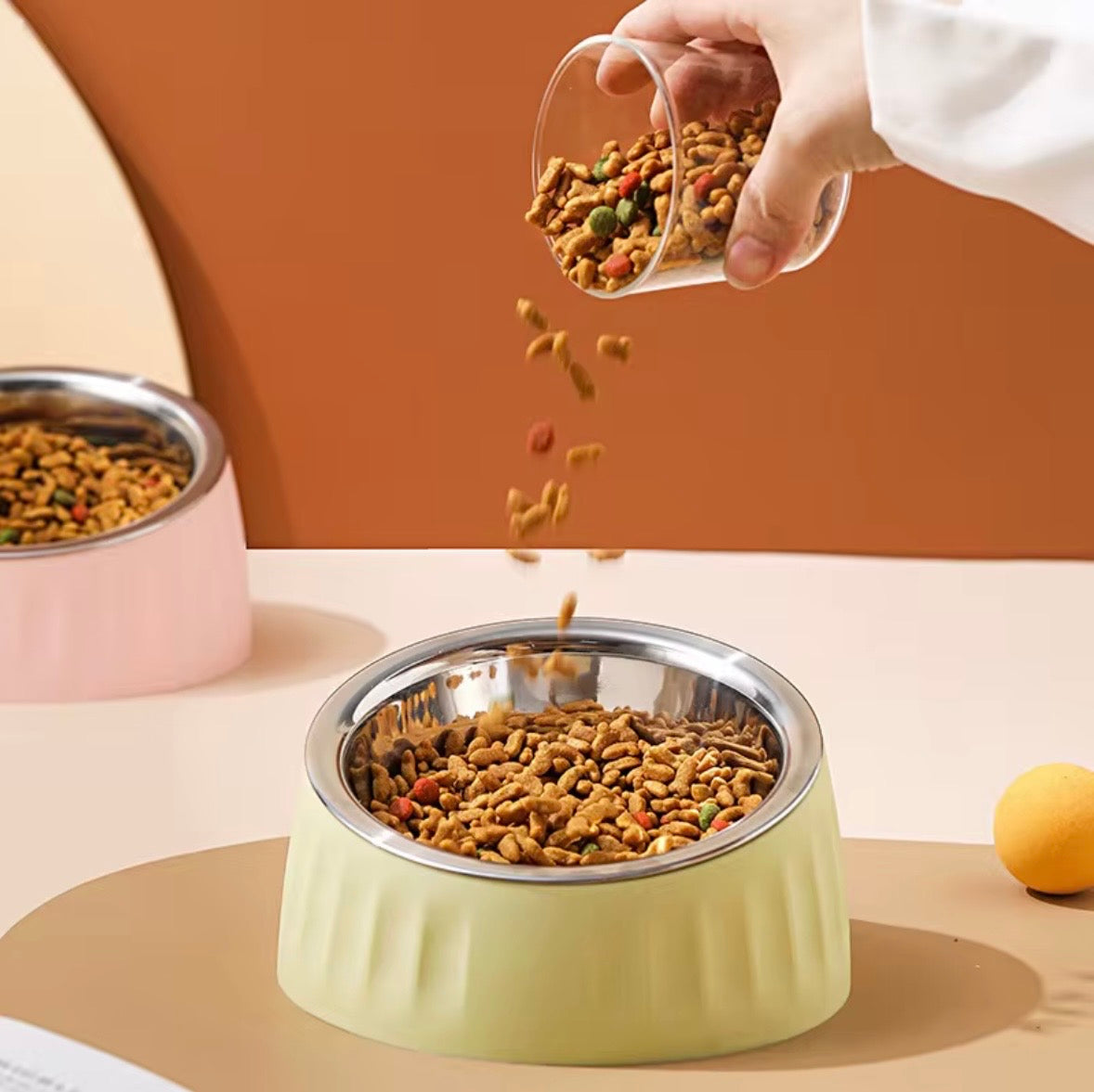These are colorful stainless steel pet bowls with an elevated, tilted design.