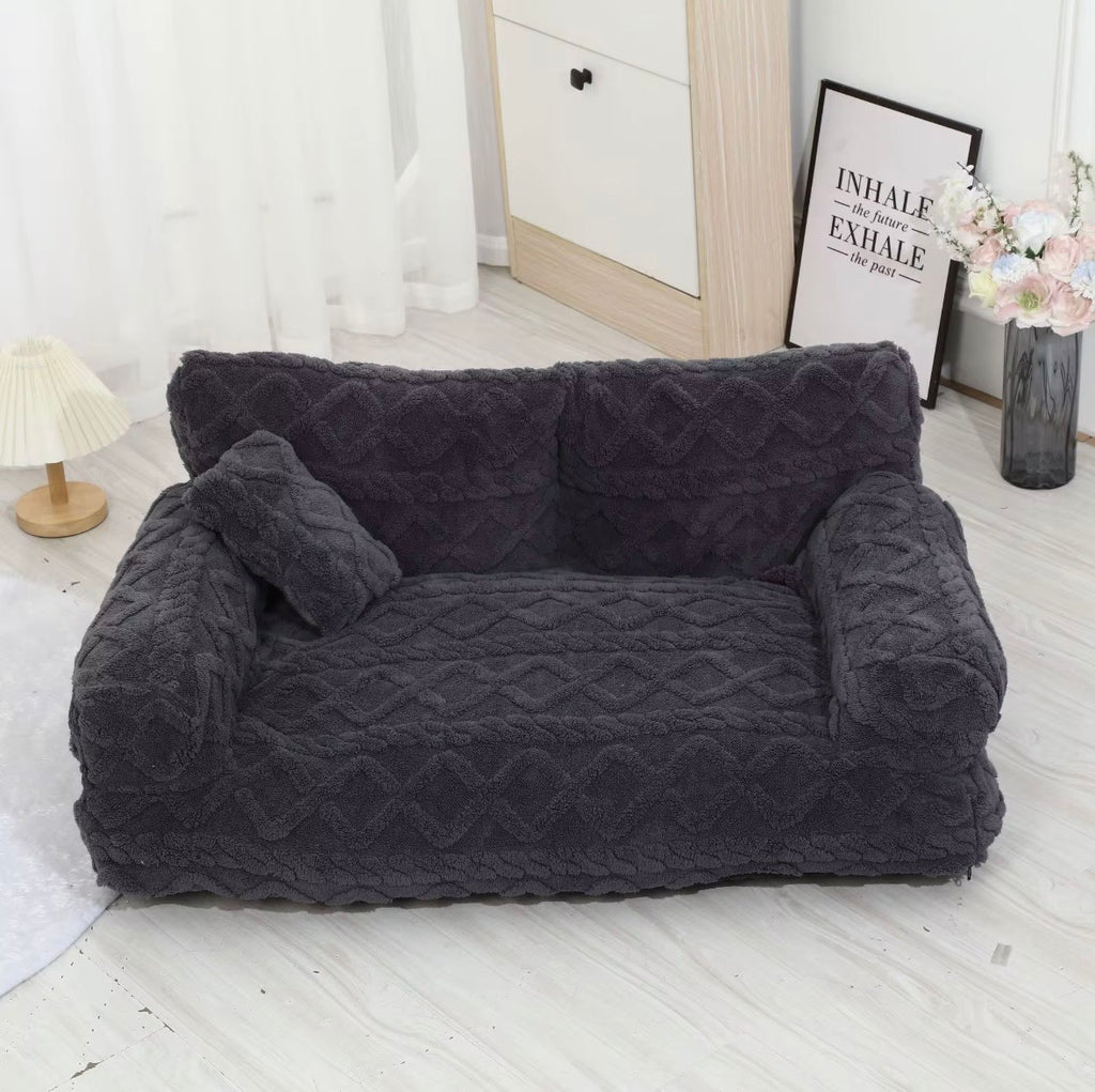 This is a plush grey cuddler pet bed