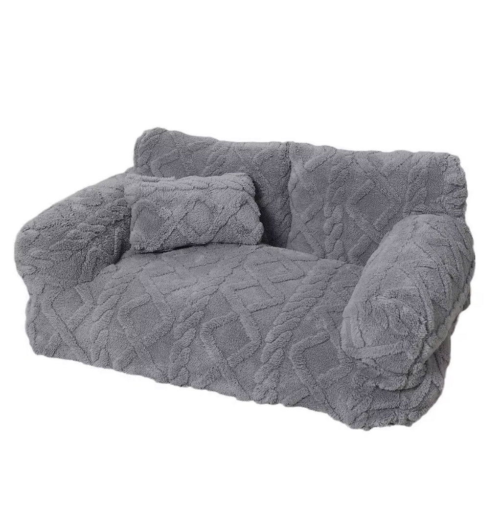 This is a plush grey cuddler pet bed