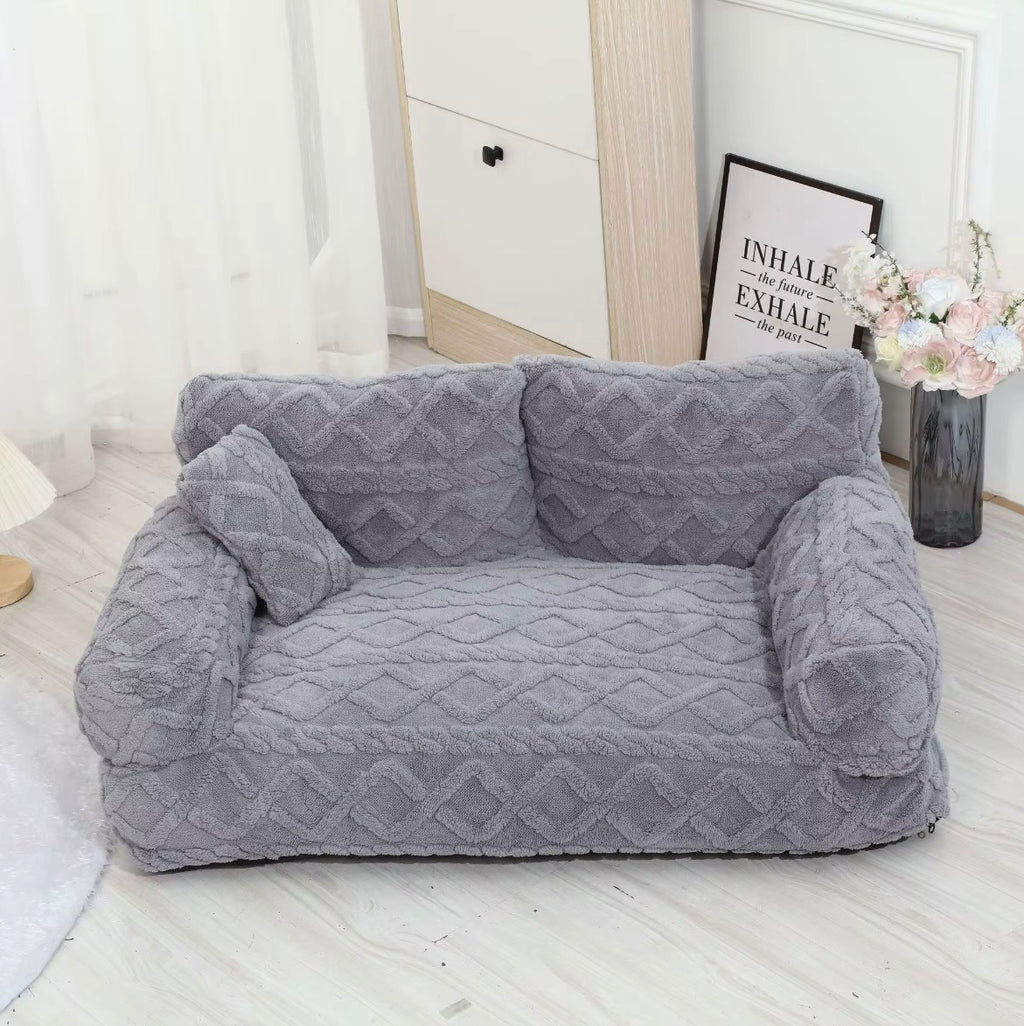 This is a plush grey cuddler pet bed
