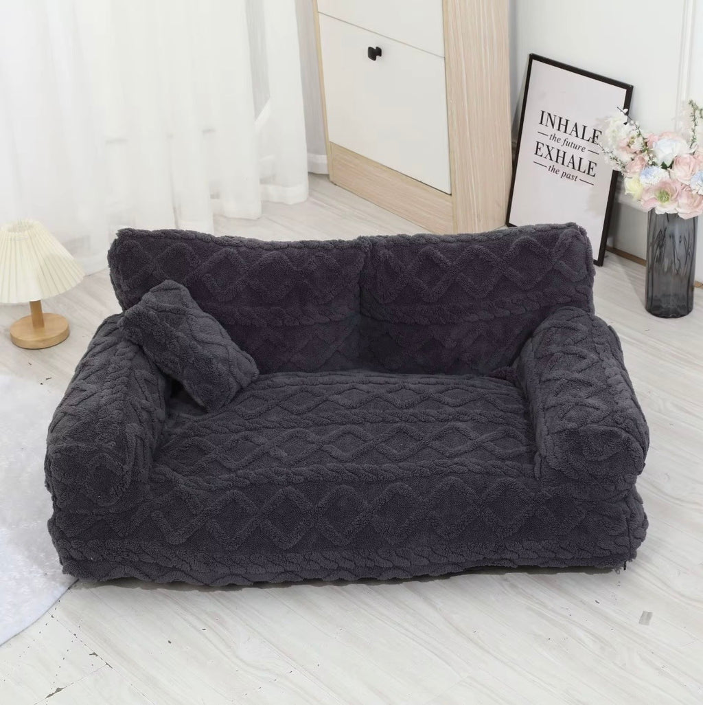 This is a plush grey cuddler pet bed