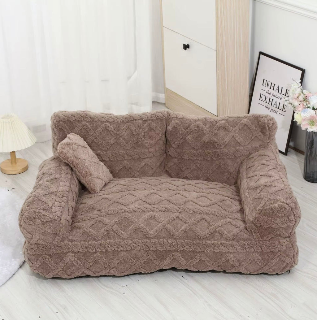 This is a plush grey cuddler pet bed