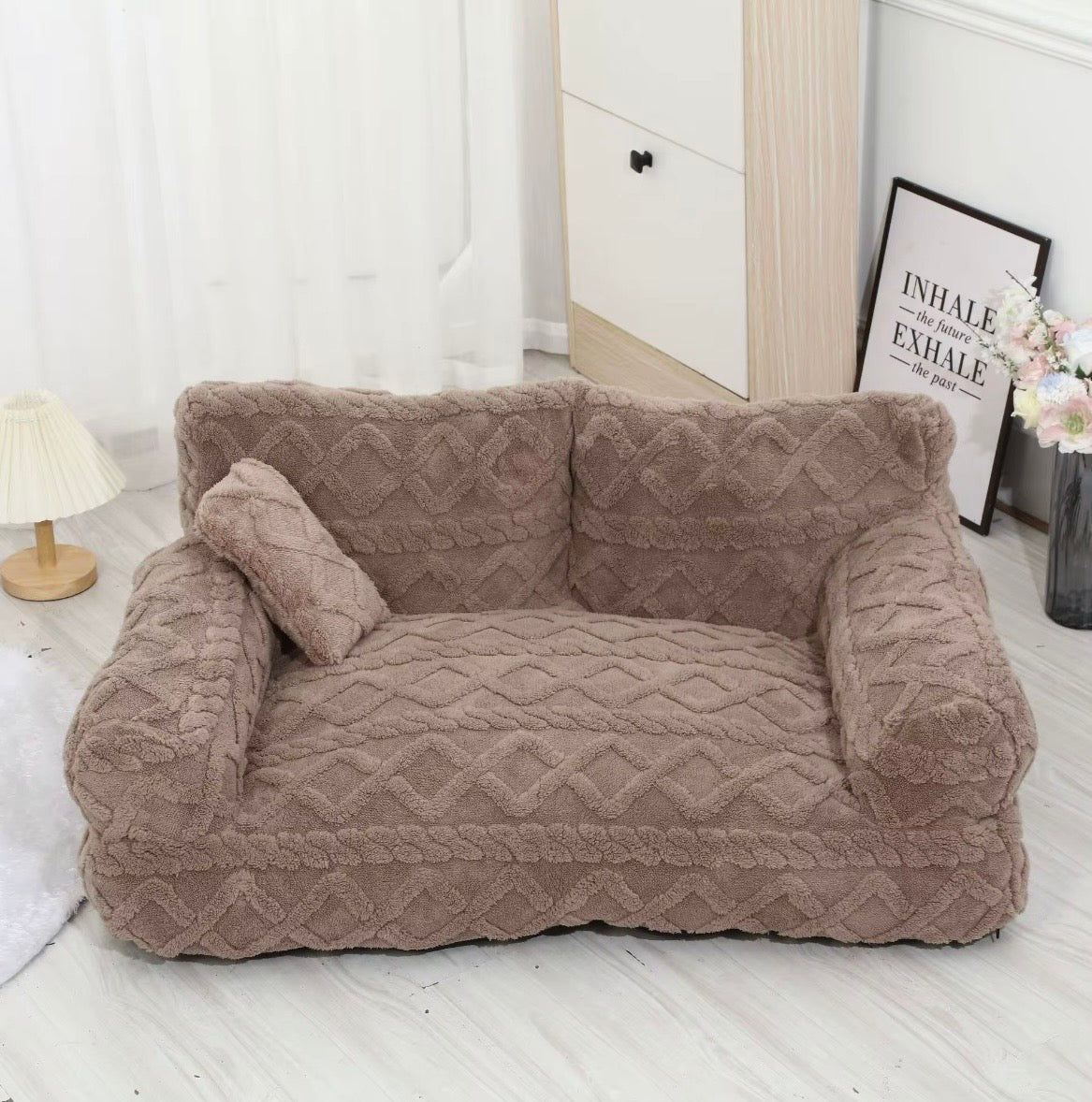 This is a plush grey cuddler pet bed