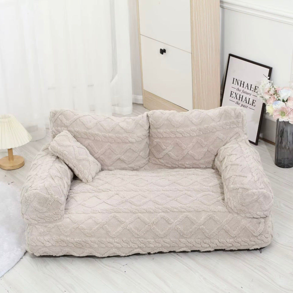 This is a plush grey cuddler pet bed