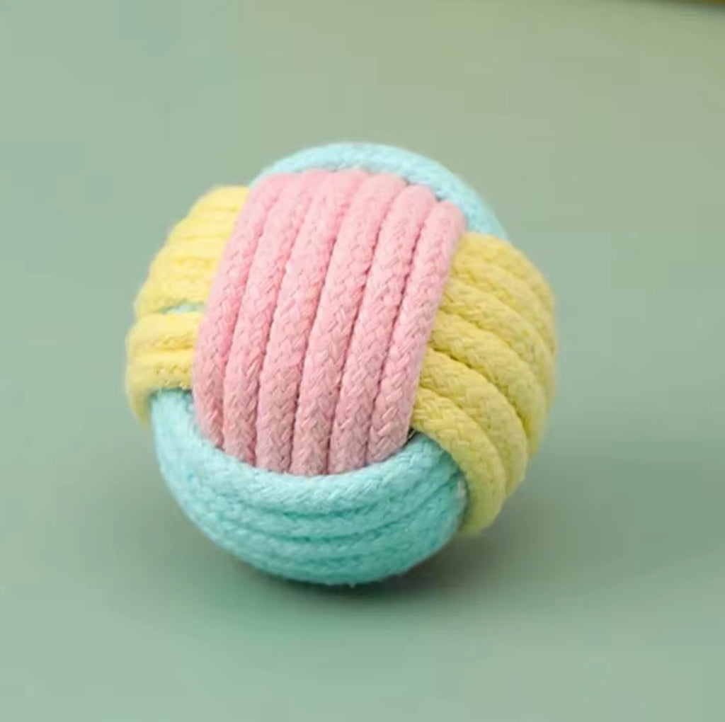 These are cotton rope cat toy balls featuring a macaron-inspired color palette.