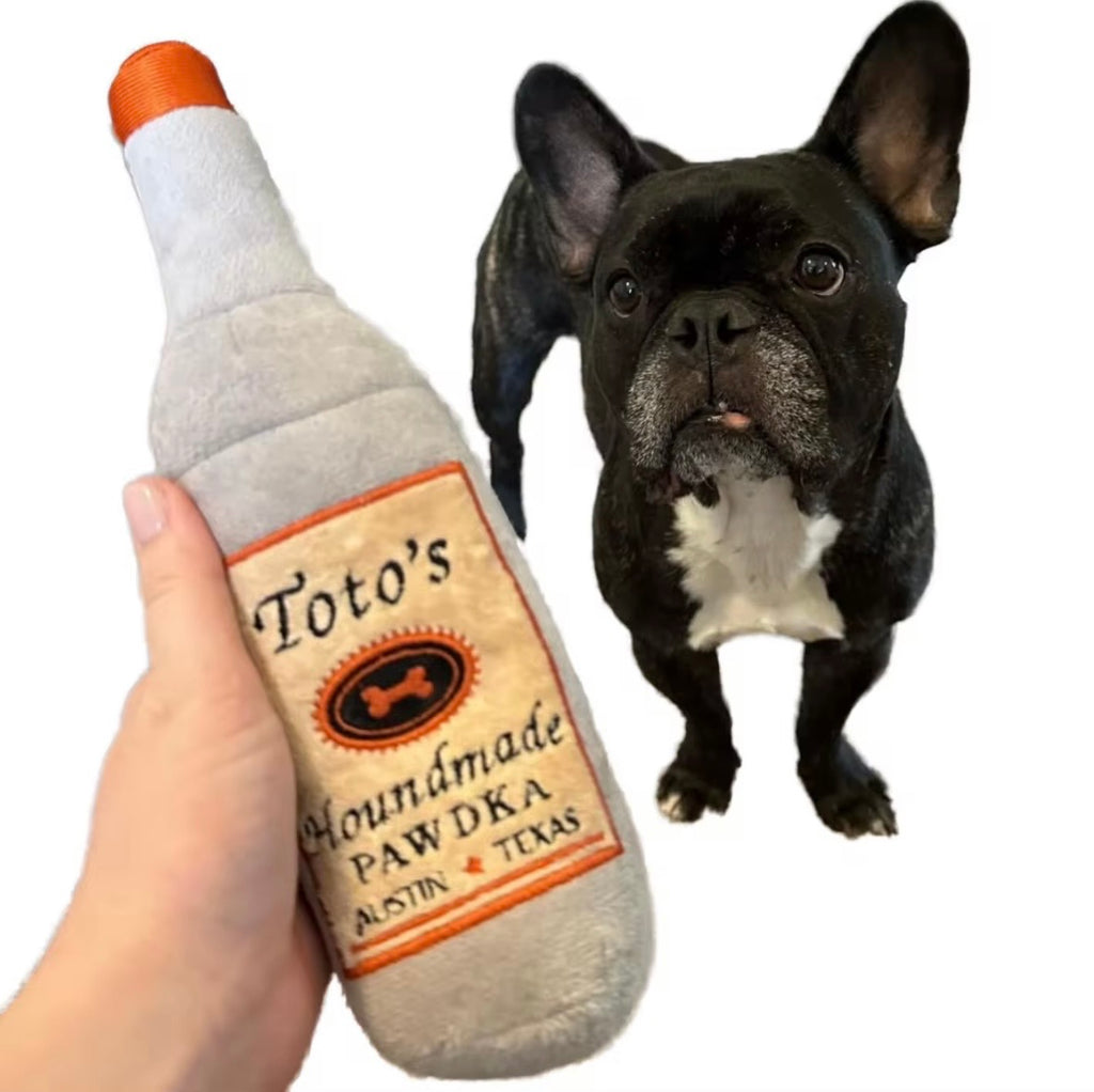 Huxley & Kent Toto's Pawdka plush dog toy.