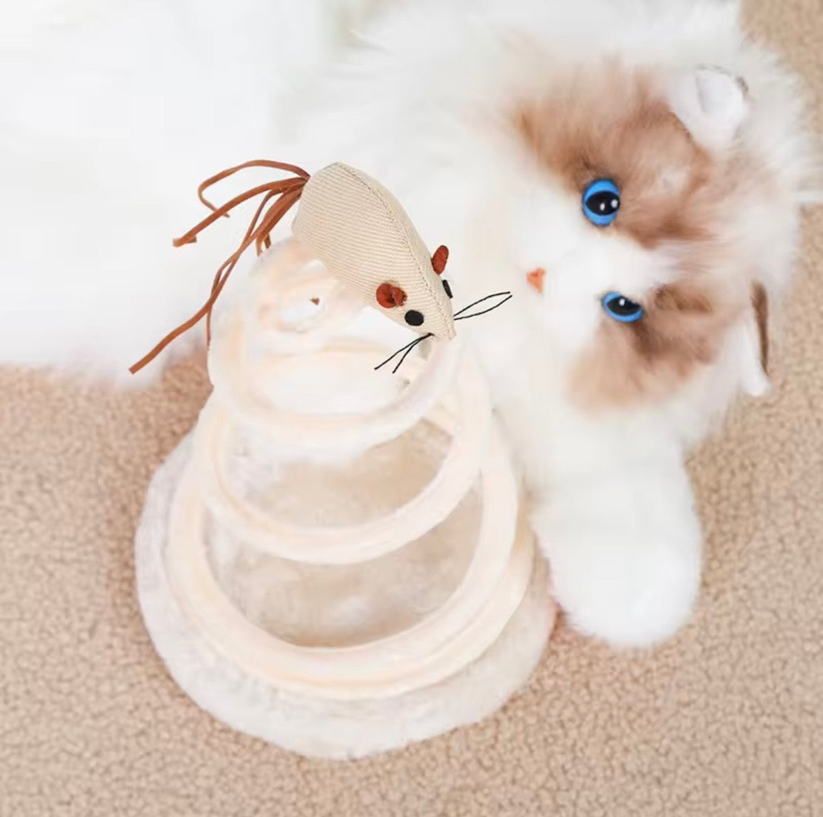 interactive cat teaser toys featuring a linen or fabric mouse, fish, or ball attached to a bouncy metal spring coil with a plush base