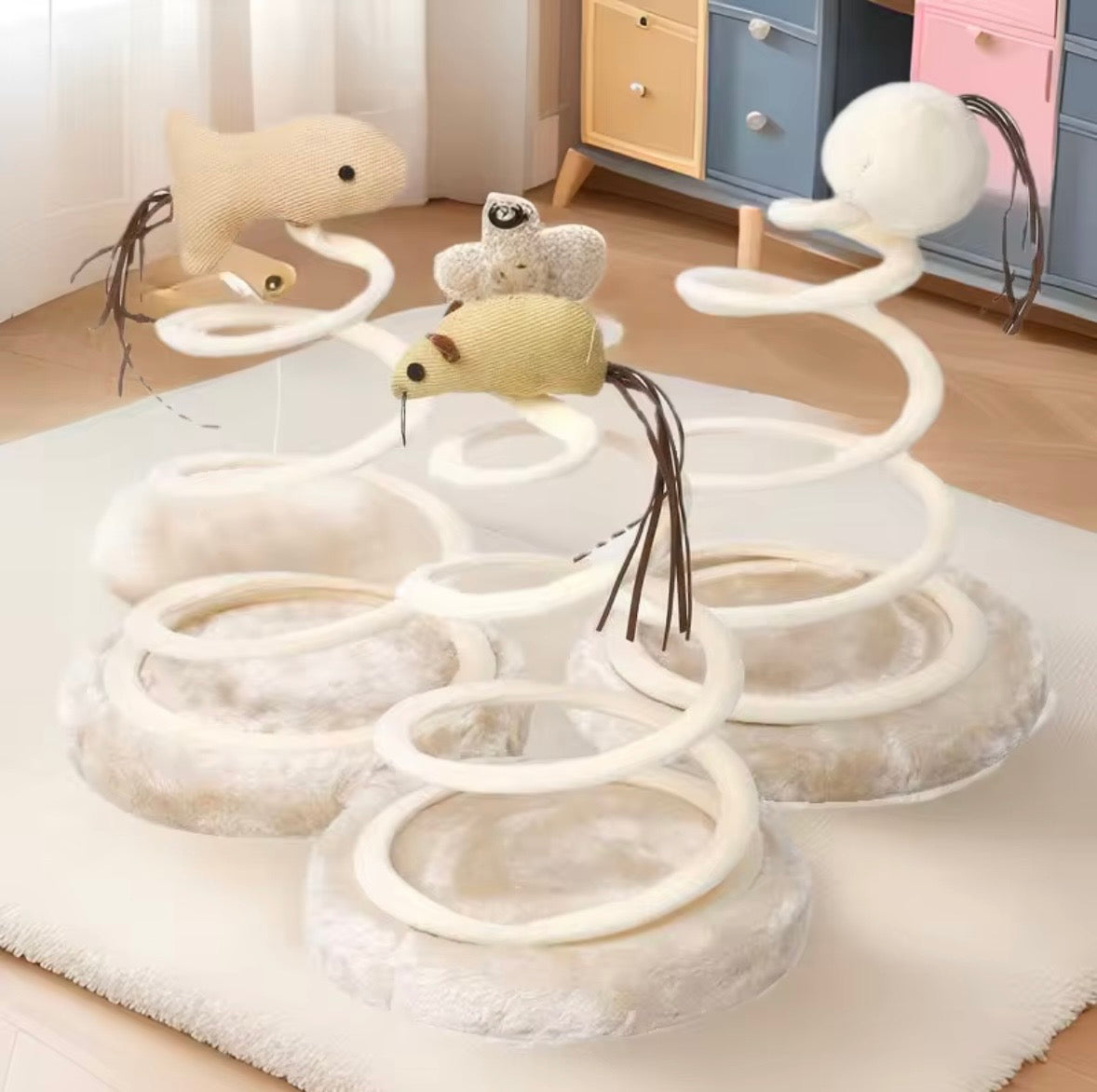 interactive cat teaser toys featuring a linen or fabric mouse, fish, or ball attached to a bouncy metal spring coil with a plush base