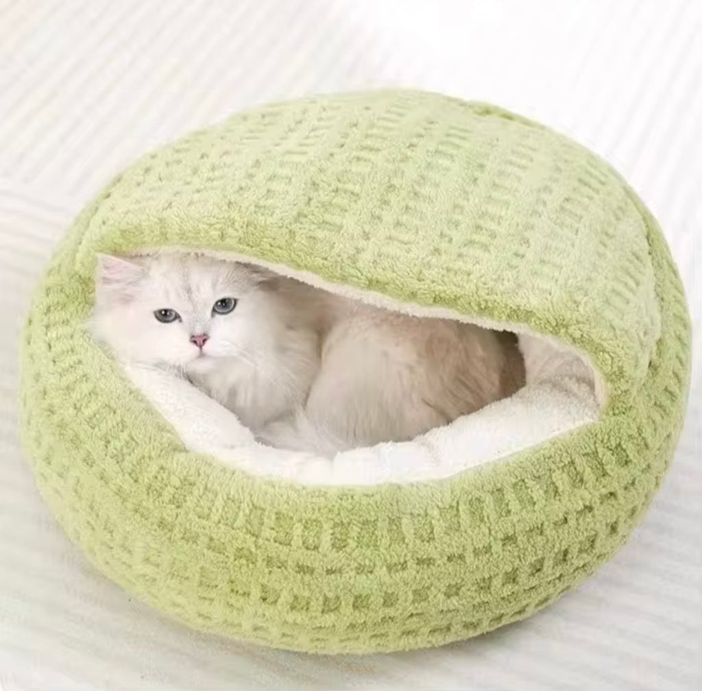 typical hooded or semi-enclosed cat beds often marketed as "winter warm" nests