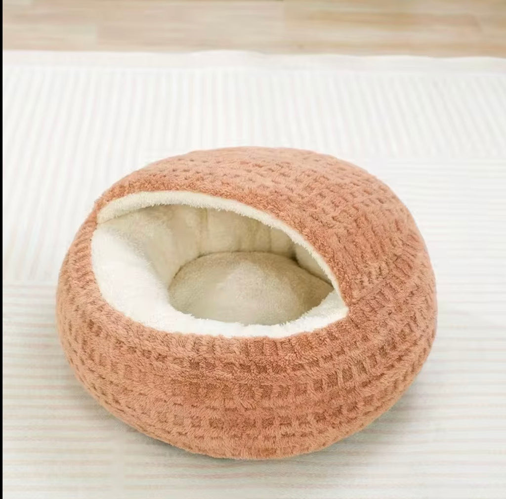 typical hooded or semi-enclosed cat beds often marketed as "winter warm" nests