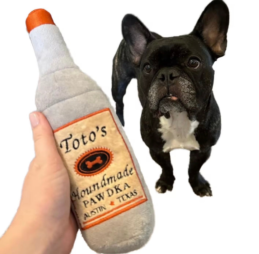 Huxley & Kent Toto's Pawdka plush dog toy.