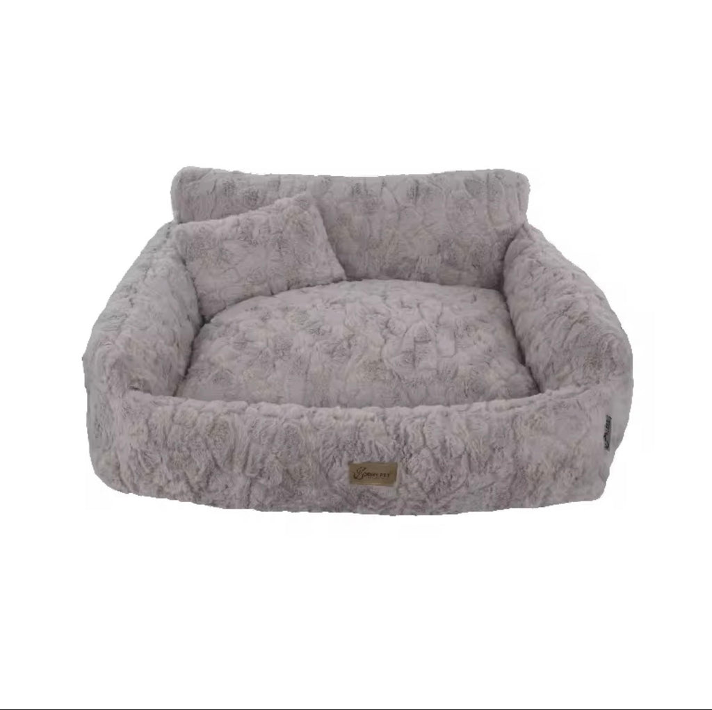 This is a plush grey cuddler pet bed